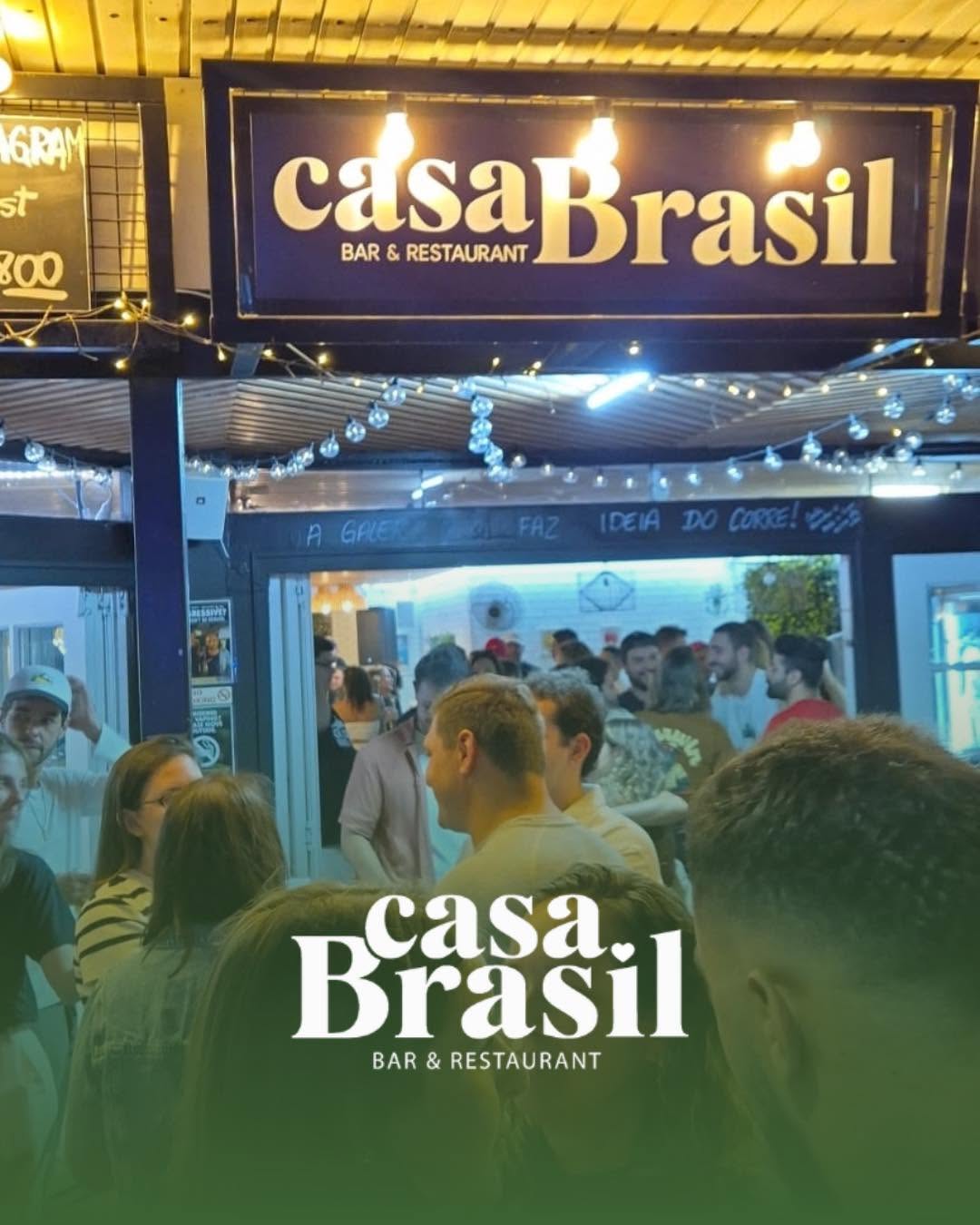 A packed crowd under the casaBrasil sign on a live music night